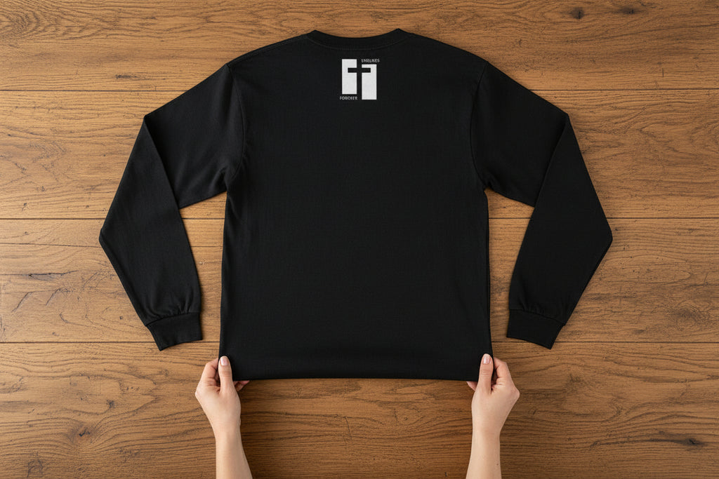 Black long-sleeve shirt with a white logo on the back against a white background