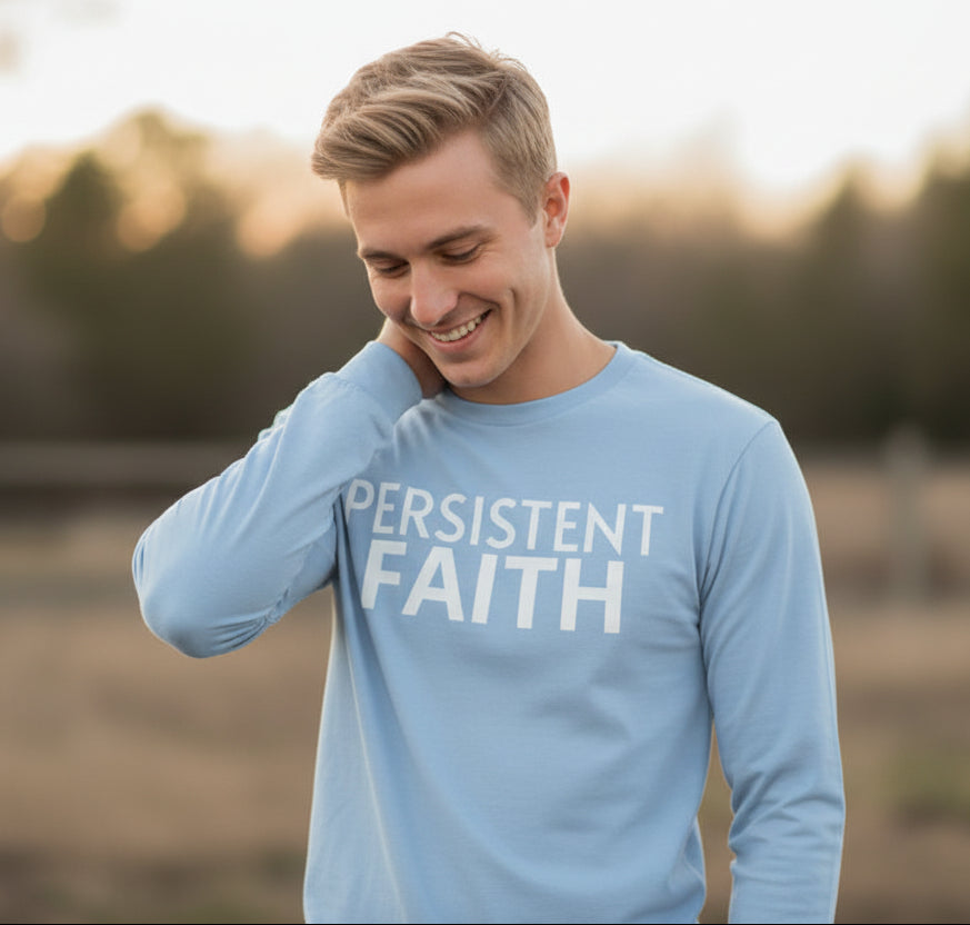 Light blue long-sleeve shirt with 'PERSISTENT FAITH' text on a white background