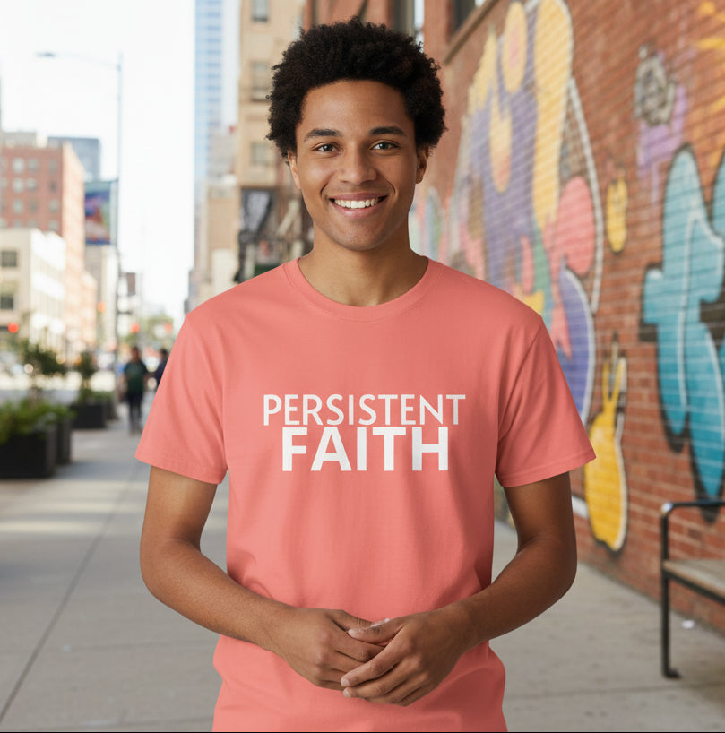Coral t-shirt with 'PERSISTENT FAITH' text on a gray background