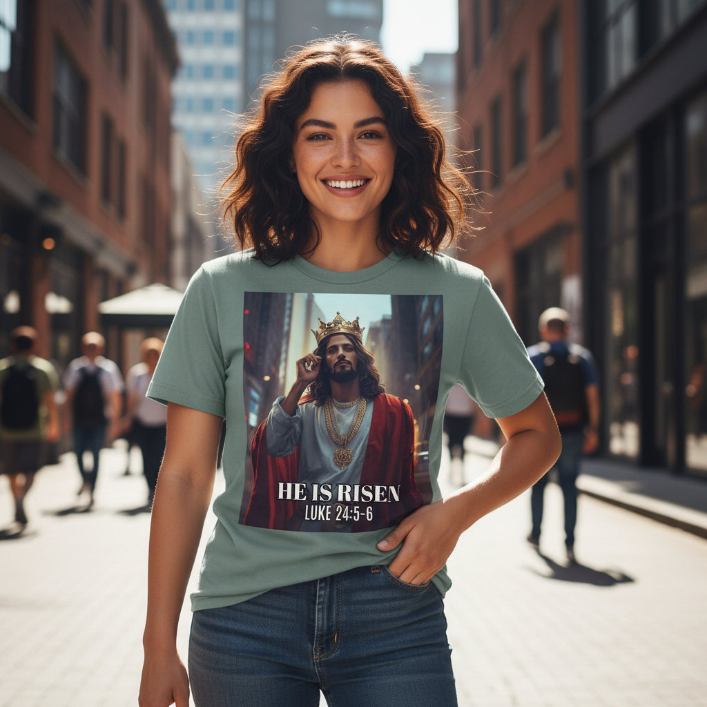 T-shirt with a graphic of a robed Latino Jesus with a crown and 'He is Risen' text on a white background
