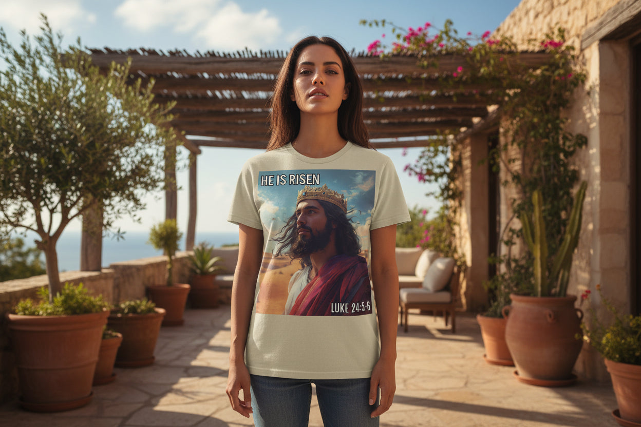 Beige t-shirt with a graphic of a MIDDLE EASTERN JESUS in a crown and 'He is Risen' text, featuring Luke 24:5-6.