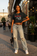 Black t-shirt with red and white text on a white background