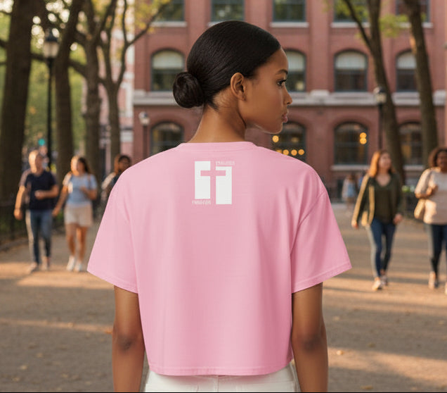 Pink t-shirt with a logo on the back against a white background