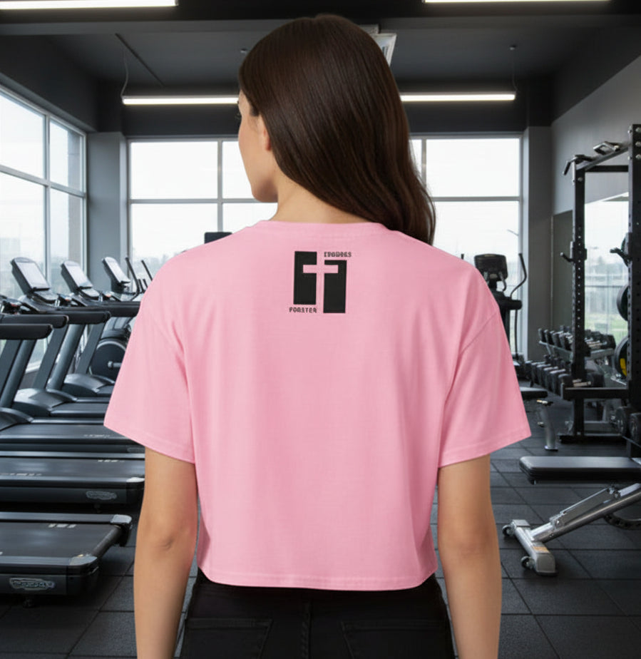 Pink t-shirt with a black cross design on the back against a dark gray background