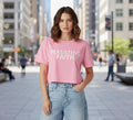 Light pink crop top with 'Persistent Faith Apparel' text on a gray background