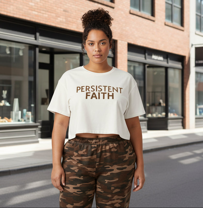 Ecru crop top with 'PERSISTENT FAITH' text in brown on a white background