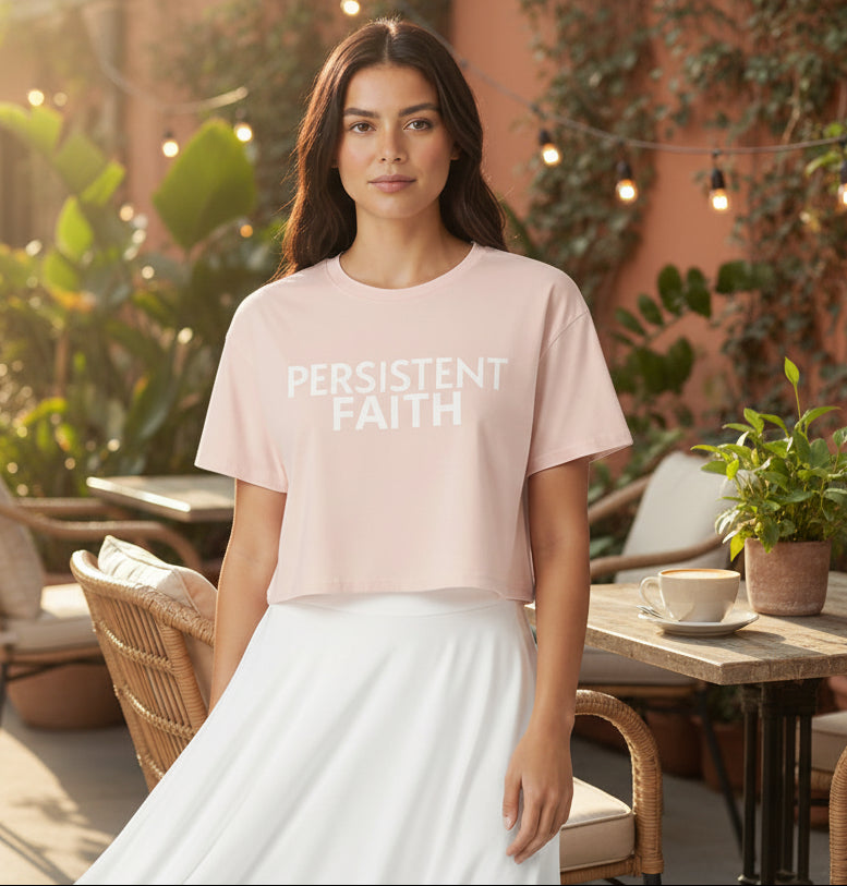 Light pink crop top with 'Persistent Faith' text on a gray background